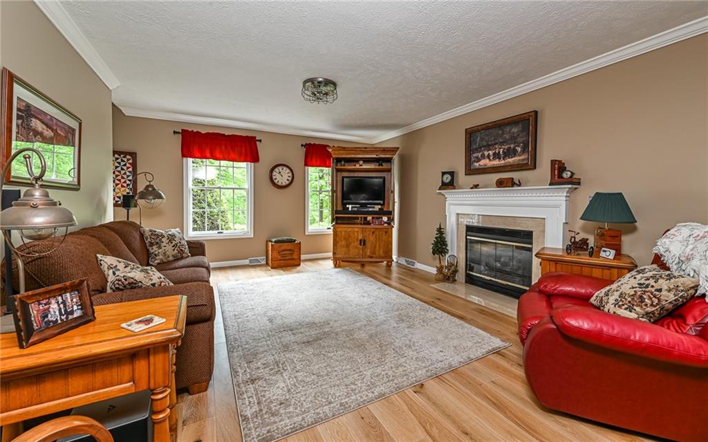 133 Miller Road Sarver, PA 16055 - Photo 12 of 50 a living room with furniture and a fireplace
