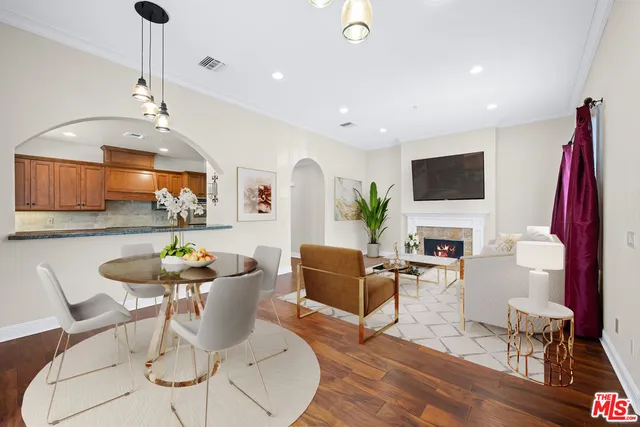 a living room with fireplace furniture and a flat screen tv