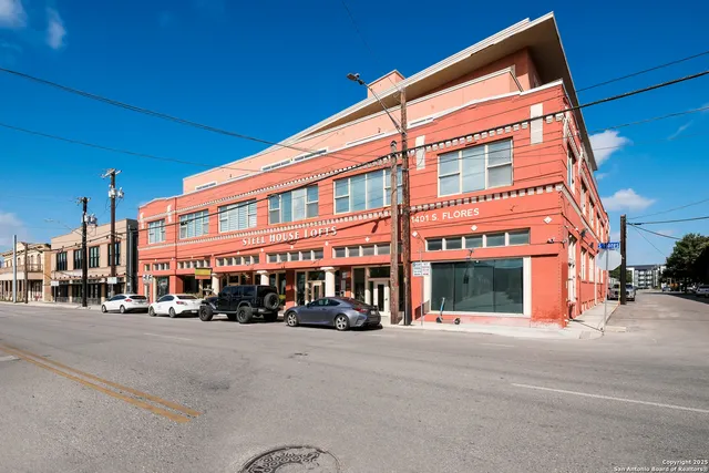 a view of a building with sitting area