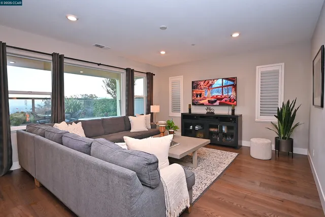 a spacious bedroom with a bed and a large window