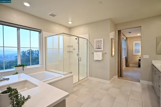 a bathroom with a double vanity sink mirror and toilet