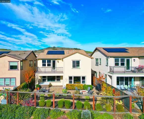 a view of a backyard with sitting area