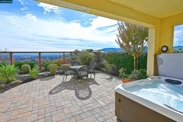 a view of a chairs and table in the patio