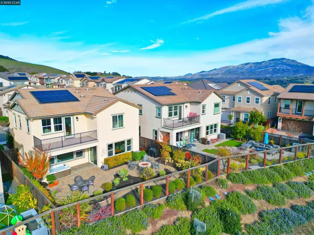 a view of a backyard with sitting area