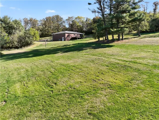 a view of a field with of trees