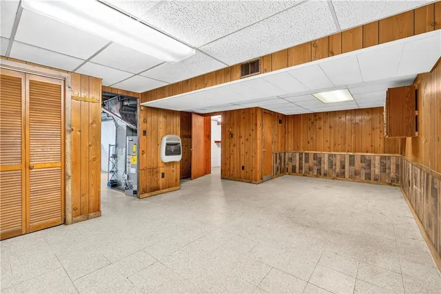 a white toilet sitting next to a bathroom sink