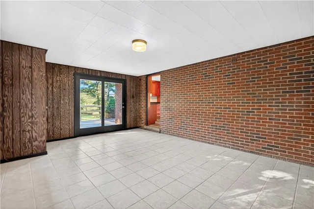 a view of an empty room with windows