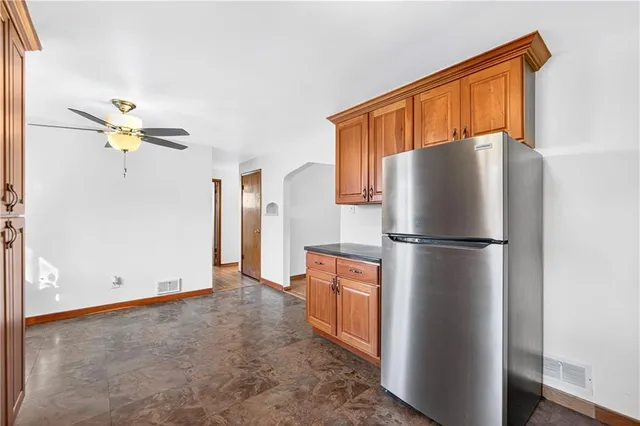 a refrigerator freezer sitting in a kitchen