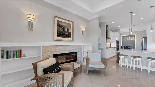 a view of a dining room with furniture and chandelier