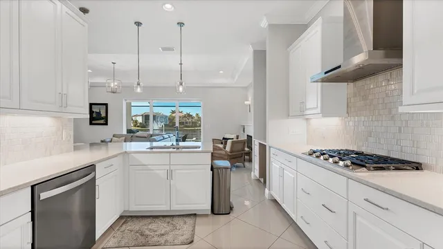 a kitchen with a sink cabinets and stainless steel appliances