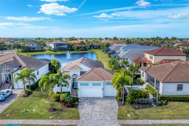 an aerial view of a house with a lake view