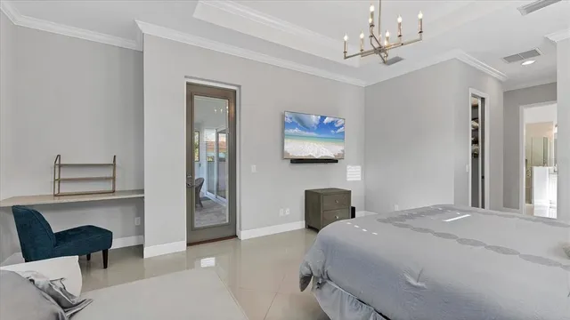 a view of walk in closet and bedroom