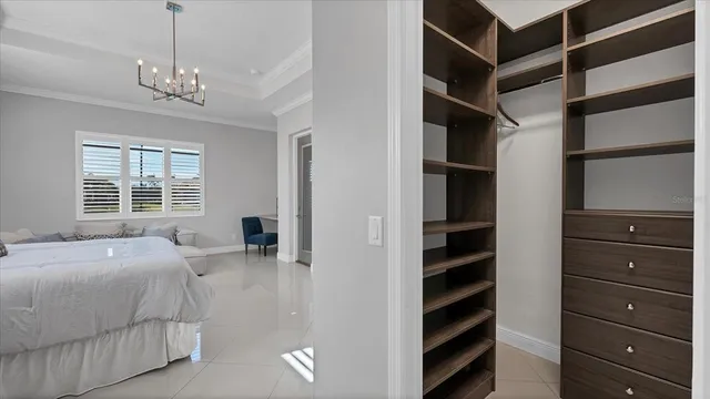 a spacious bathroom with a granite countertop sink and a mirror