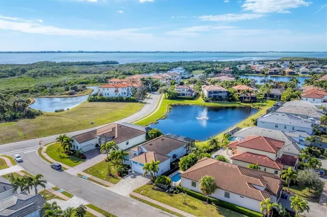 an aerial view of a city with lawn chairs