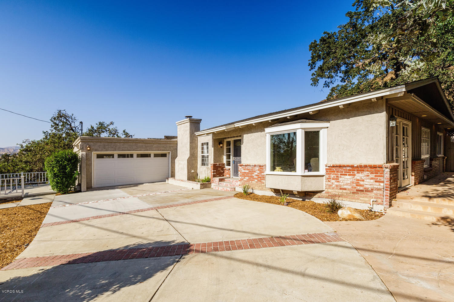 5829 Oak Knolls Road Simi Valley, CA 93063 - Photo 1 of 33 a house view with a outdoor space