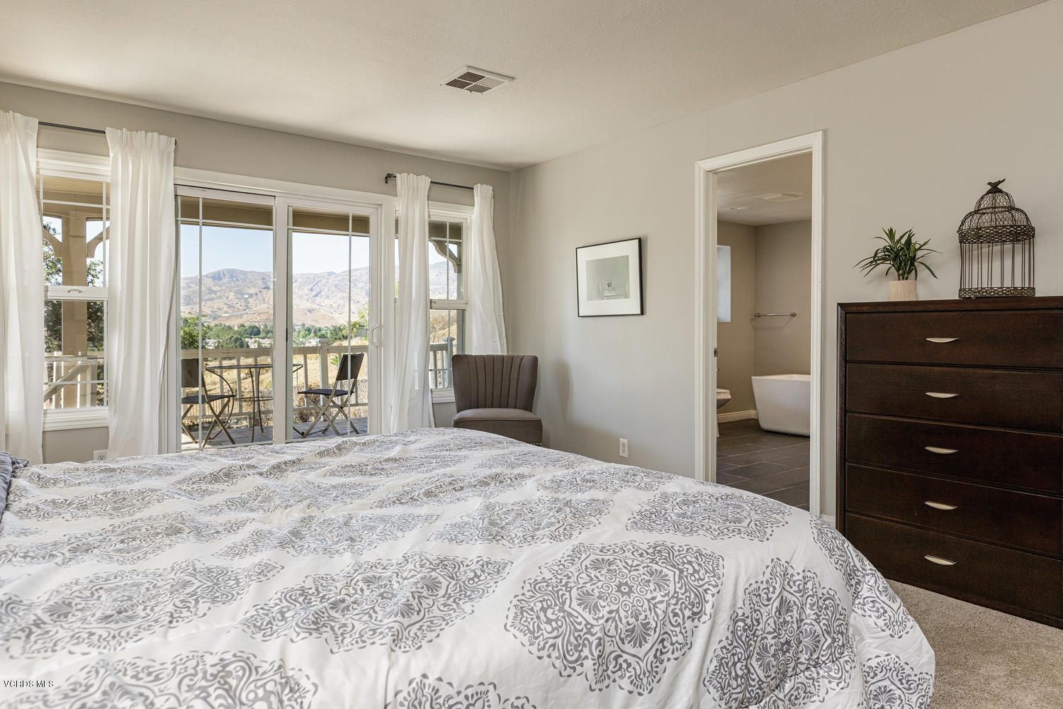 5829 Oak Knolls Road Simi Valley, CA 93063 - Photo 14 of 33 a bedroom with a bed and a large window
