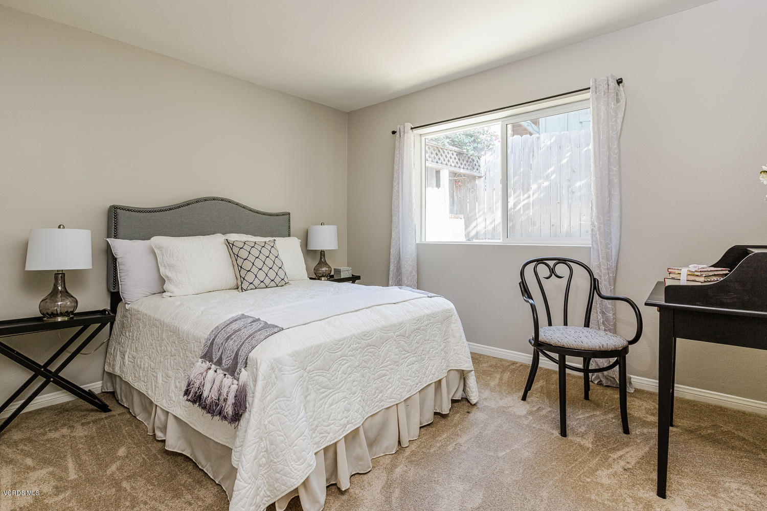 5829 Oak Knolls Road Simi Valley, CA 93063 - Photo 17 of 33 a bedroom with a bed and a window with chair