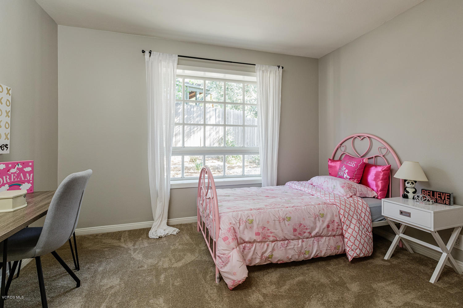 5829 Oak Knolls Road Simi Valley, CA 93063 - Photo 18 of 33 a bedroom with a bed a desk and chair