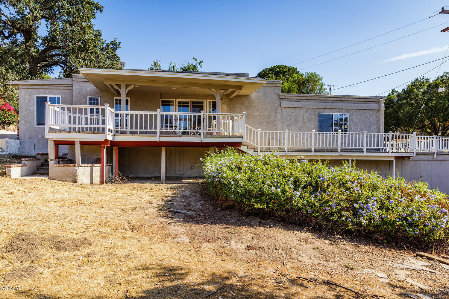 5829 Oak Knolls Road Simi Valley, CA 93063 - Photo 21 of 33 a front view of a house with a yard