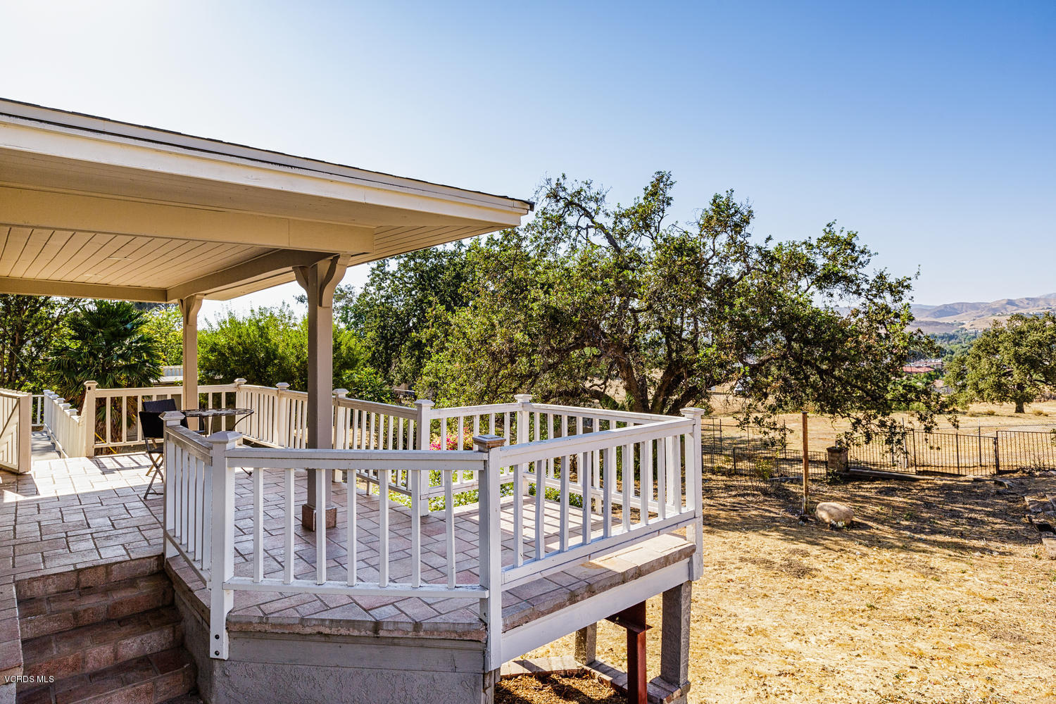 5829 Oak Knolls Road Simi Valley, CA 93063 - Photo 22 of 33 a view of a wooden deck with furniture