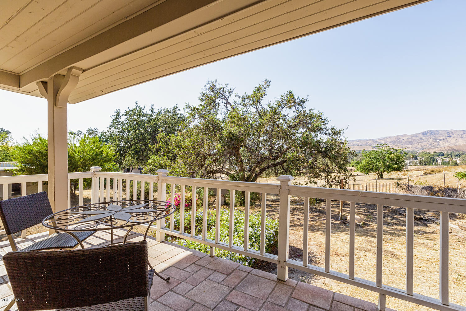 5829 Oak Knolls Road Simi Valley, CA 93063 - Photo 30 of 33 a view of a chairs and table in the balcony