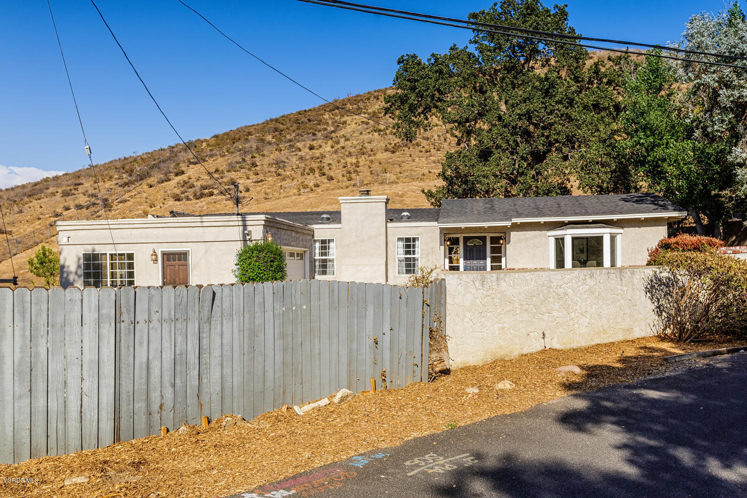 5829 Oak Knolls Road Simi Valley, CA 93063 - Photo 32 of 33 a view of a house with a backyard