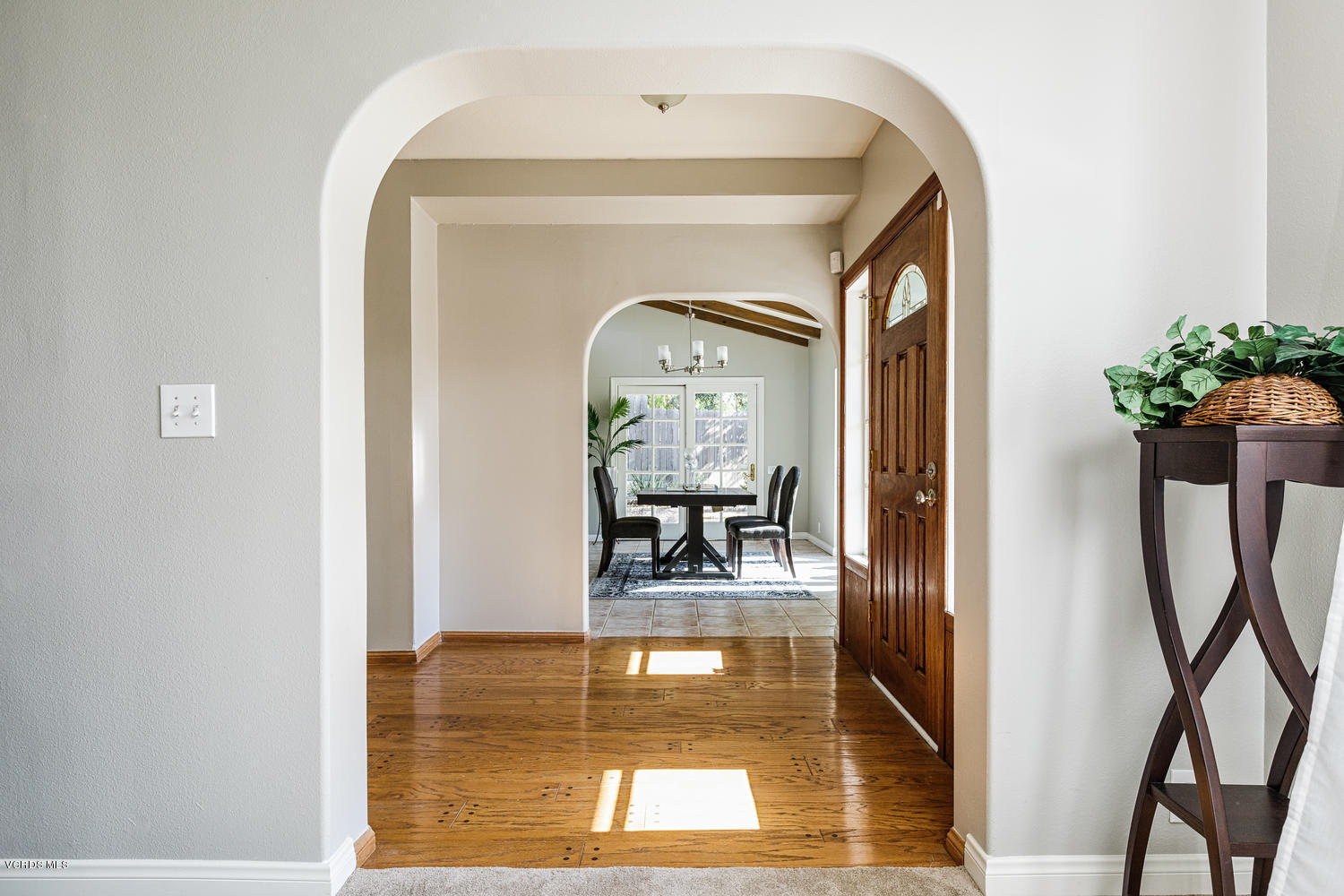 5829 Oak Knolls Road Simi Valley, CA 93063 - Photo 6 of 33 a picture of a living room with a floor to ceiling window and wooden floor
