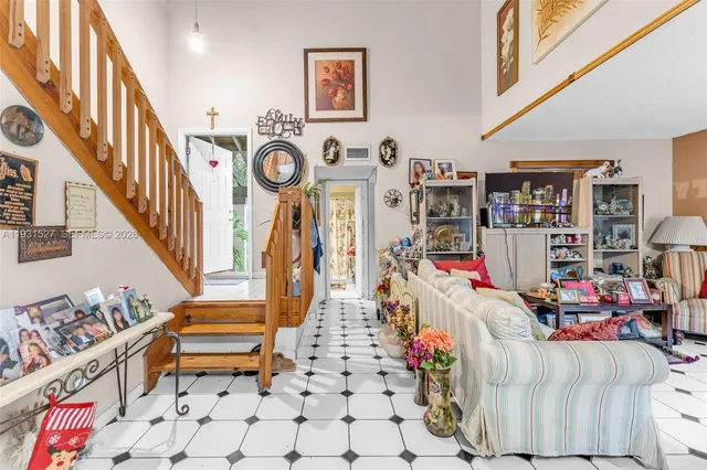 a living room with lots of furniture and baby chairs