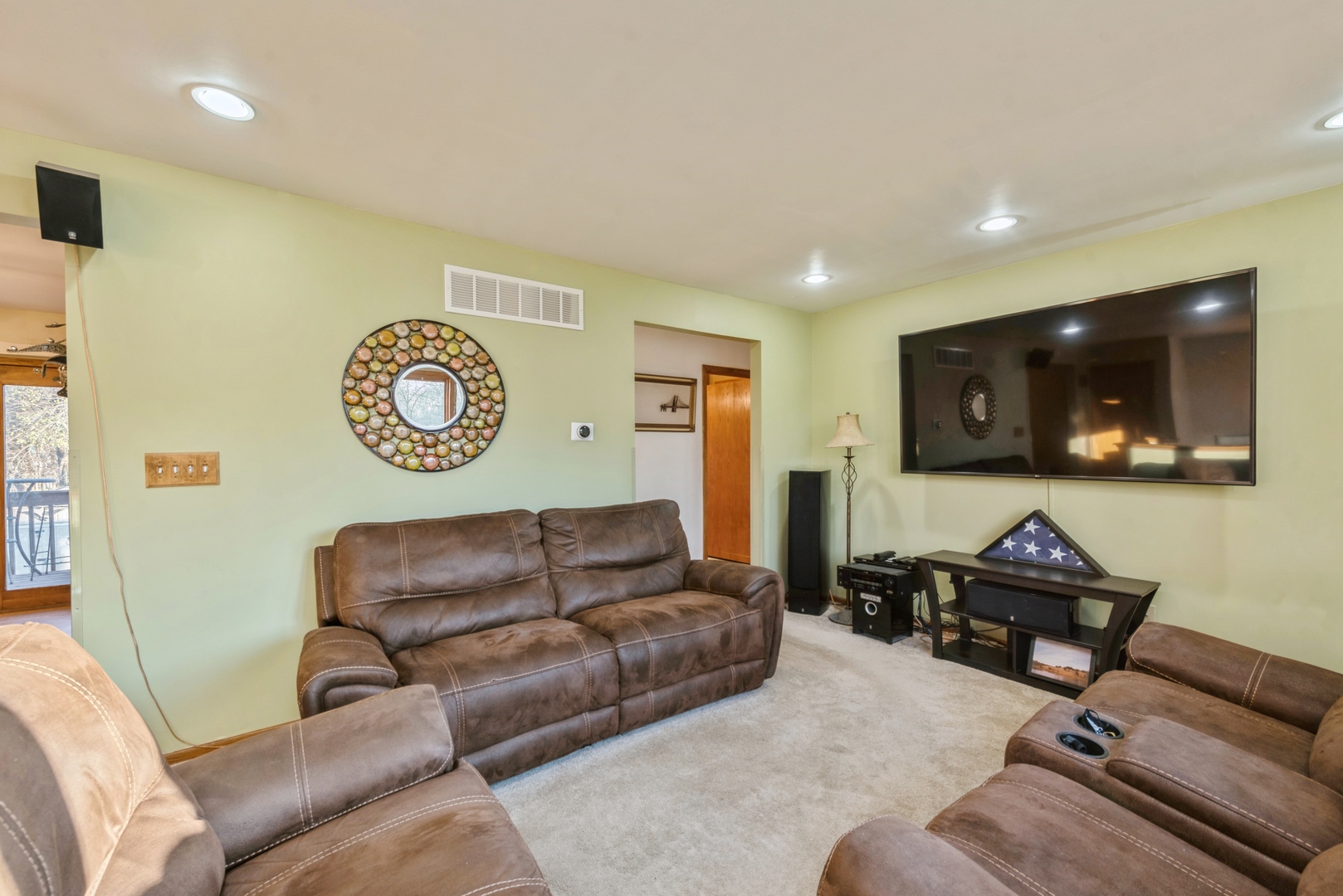 2507 Crystal Lake Road Cary, IL 60013 - Photo 2 of 18 a living room with furniture and a flat screen tv