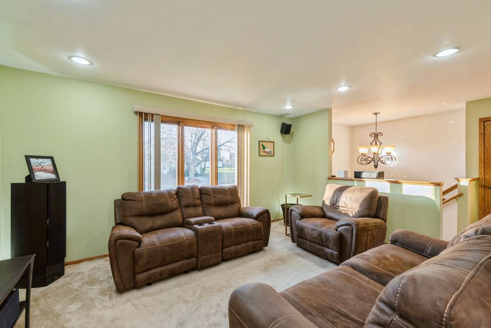 2507 Crystal Lake Road Cary, IL 60013 - Photo 3 of 18 a living room with furniture window and a flat screen tv