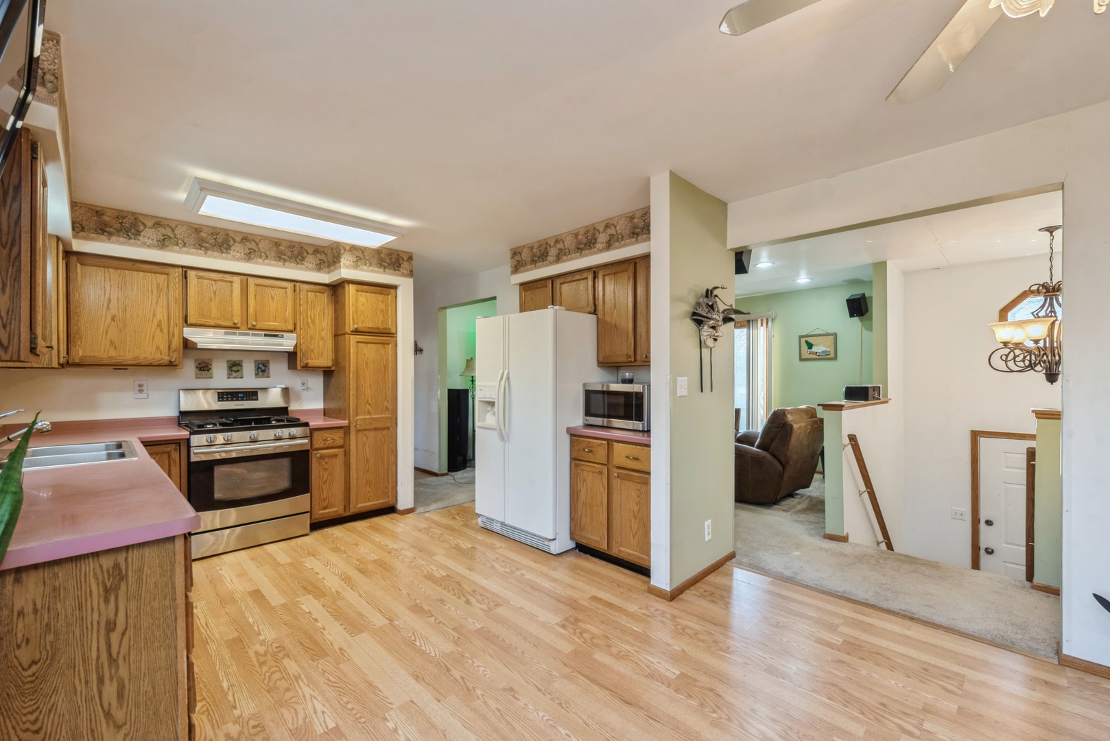 2507 Crystal Lake Road Cary, IL 60013 - Photo 4 of 18 a kitchen with granite countertop a refrigerator stove and oven