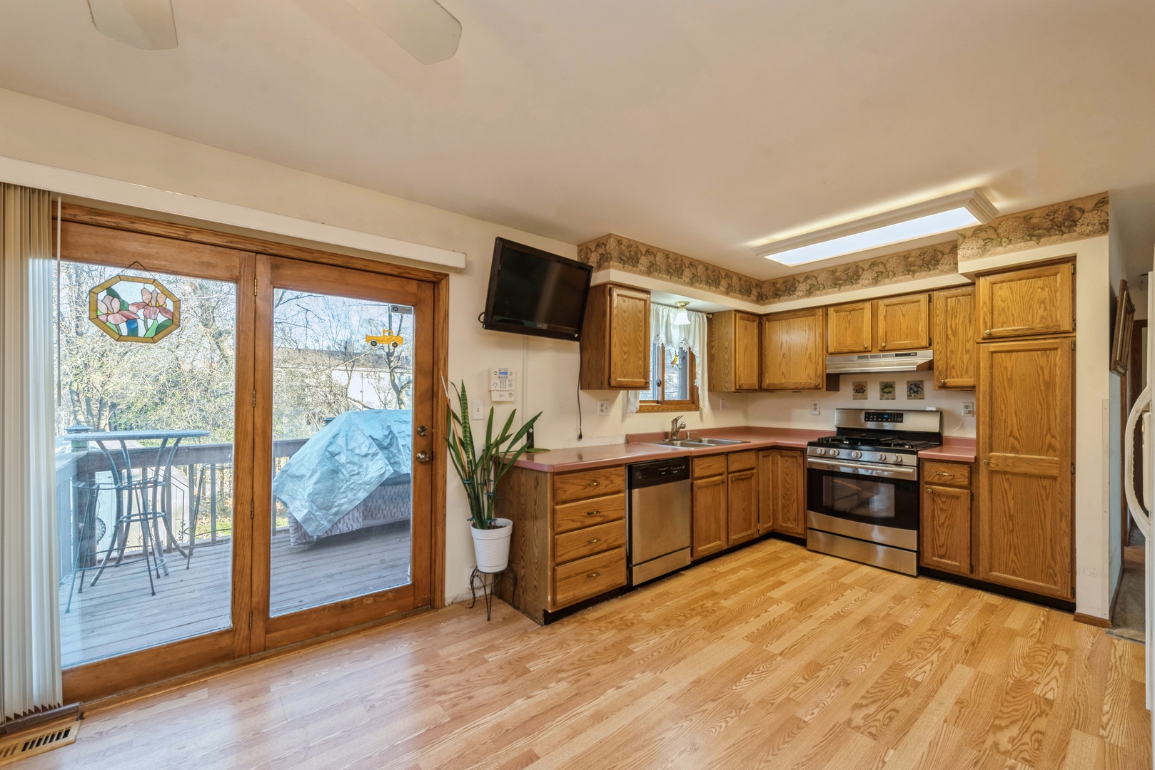 2507 Crystal Lake Road Cary, IL 60013 - Photo 5 of 18 a large kitchen with stainless steel appliances granite countertop a stove and a refrigerator
