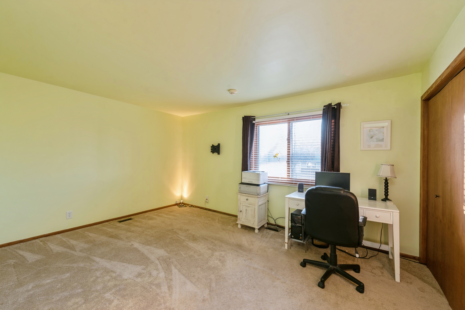 2507 Crystal Lake Road Cary, IL 60013 - Photo 6 of 18 a view of a workspace with furniture and a window