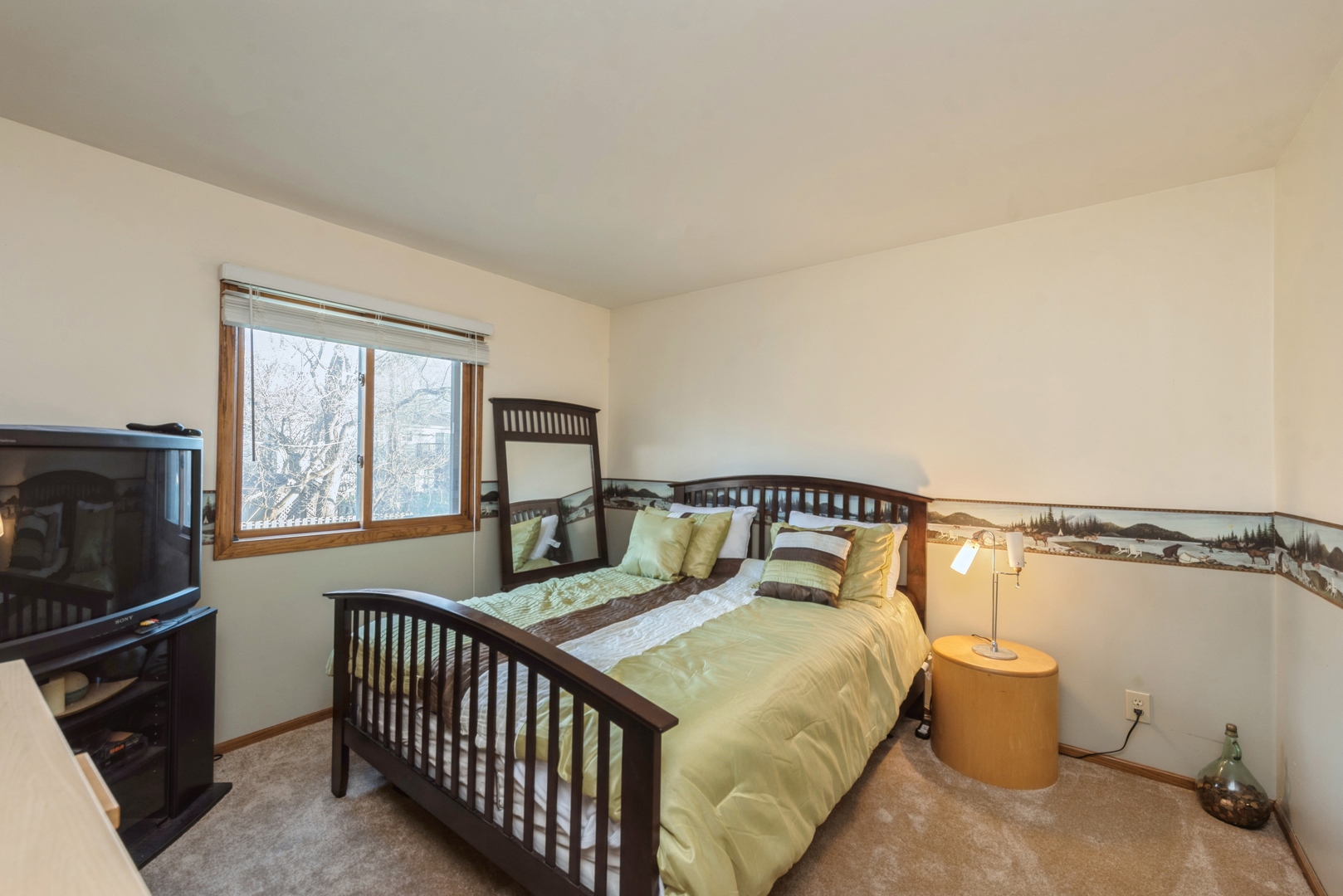 2507 Crystal Lake Road Cary, IL 60013 - Photo 7 of 18 a bedroom with a bed and wooden floor