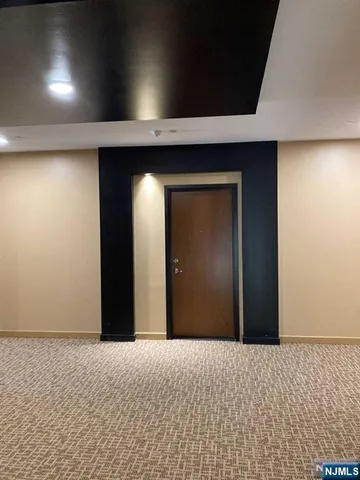 a view of a livingroom with a wooden wall