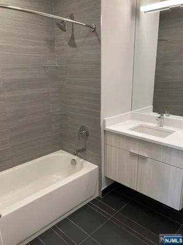 a bathroom with a sink a toilet and a bathtub