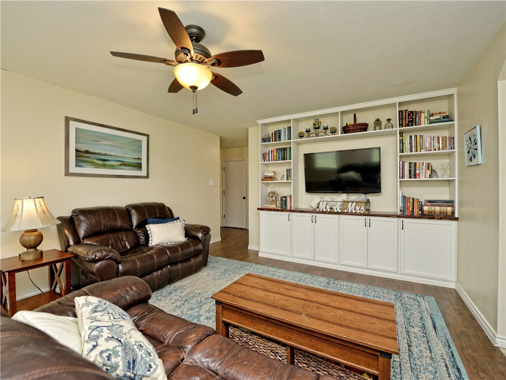 325 Spring Branch Loop Kyle, TX 78640 - Photo 1 of 1 a living room with furniture and a flat screen tv