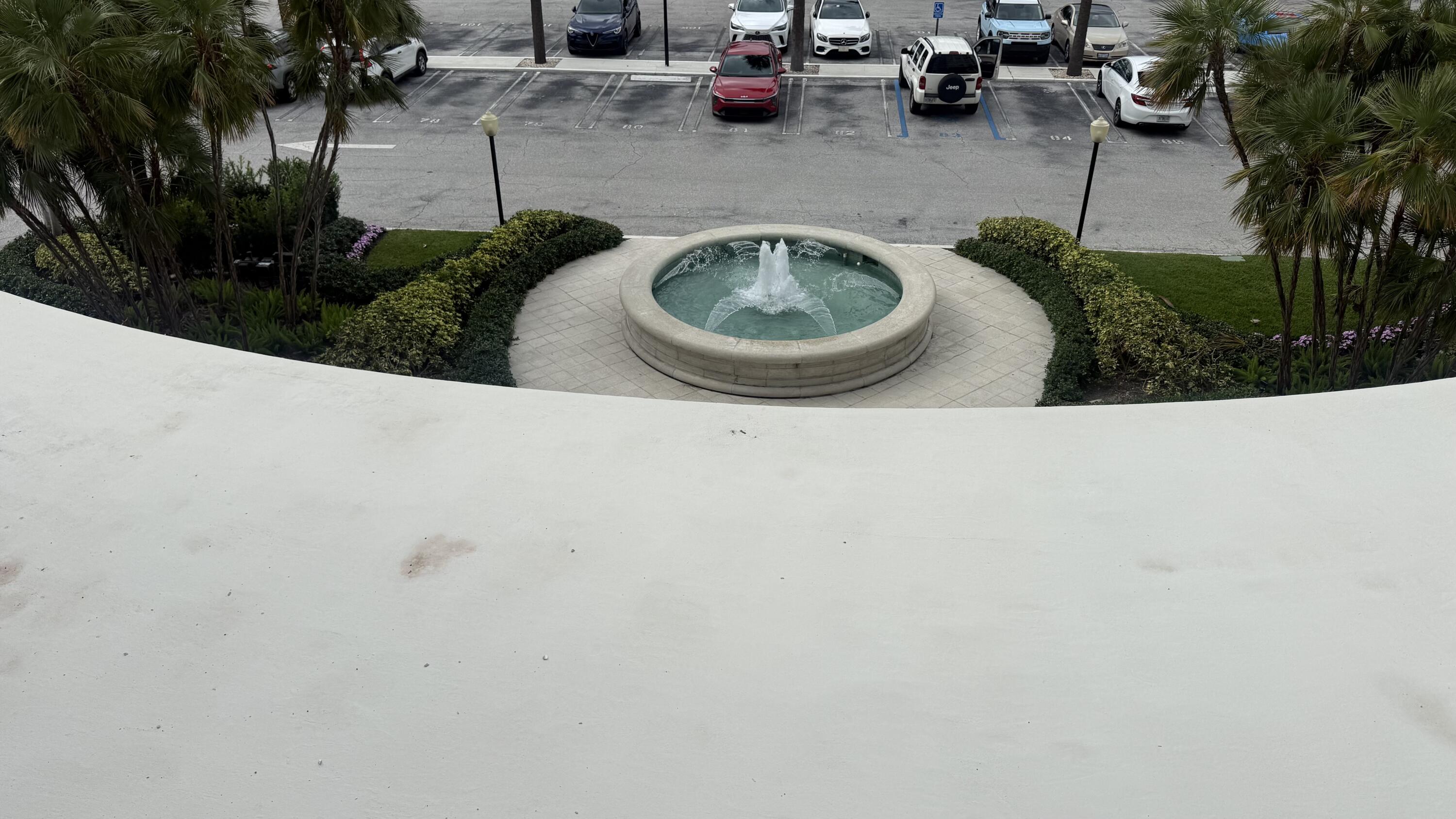 2600 North Flagler Drive, Unit 313 West Palm Beach, FL 33407 - Photo 19 of 19 a view of a backyard with plants and a patio