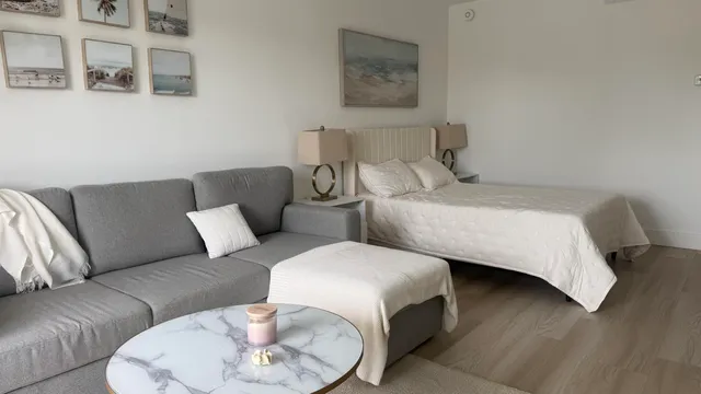 a bedroom with a bed and a couch