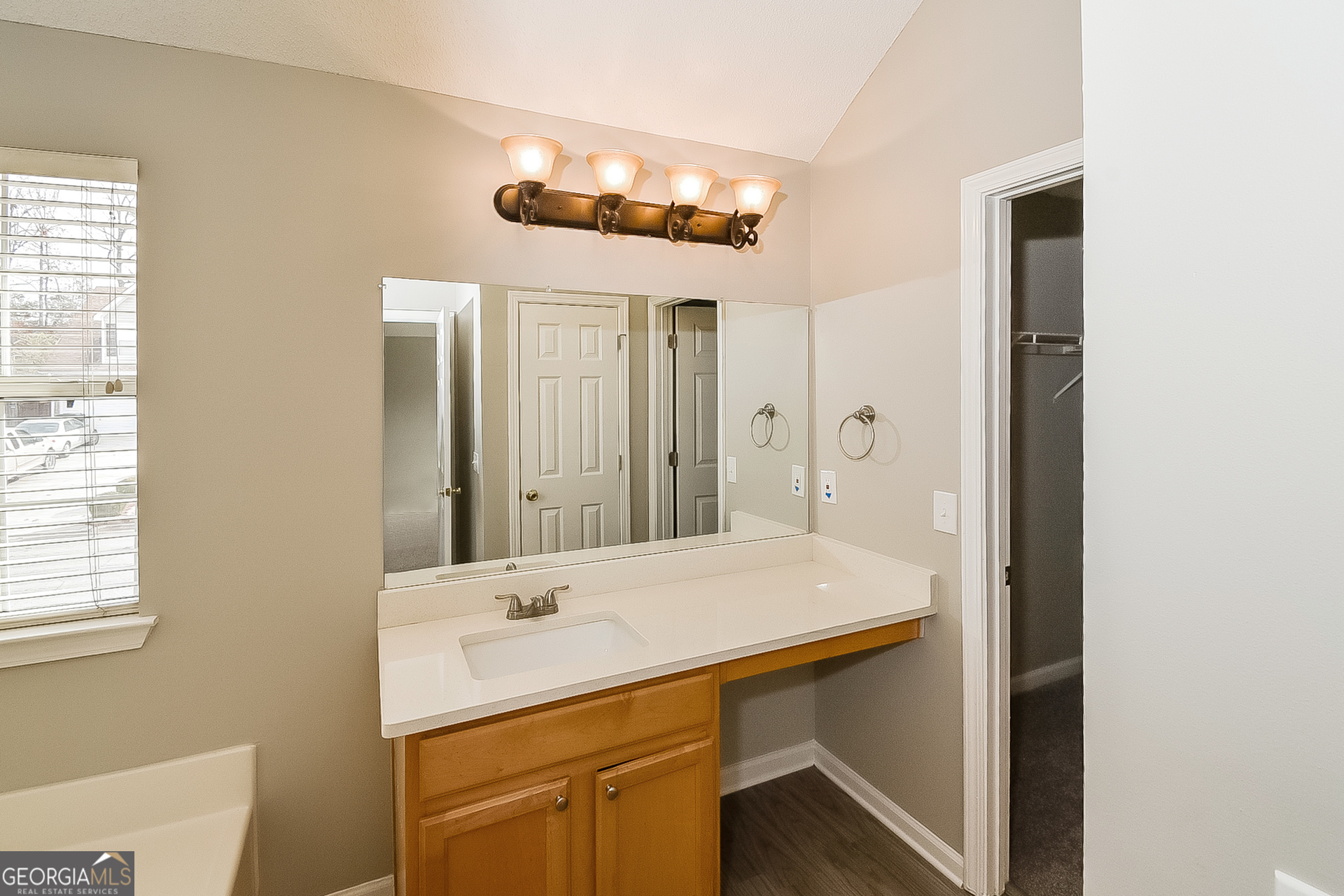 200 Teak Lane Fairburn, GA 30213 - Photo 11 of 17 a bathroom with a sink and a mirror