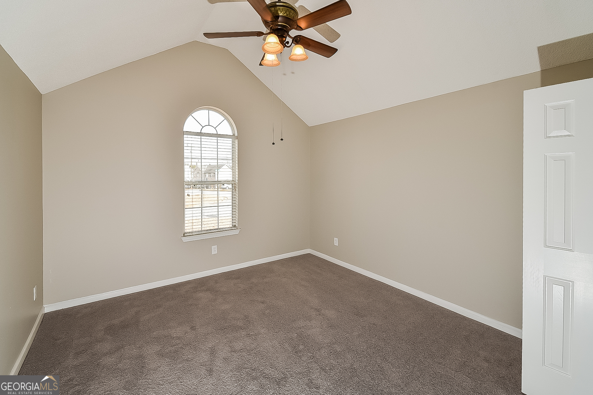 200 Teak Lane Fairburn, GA 30213 - Photo 13 of 17 an empty room with windows and fan