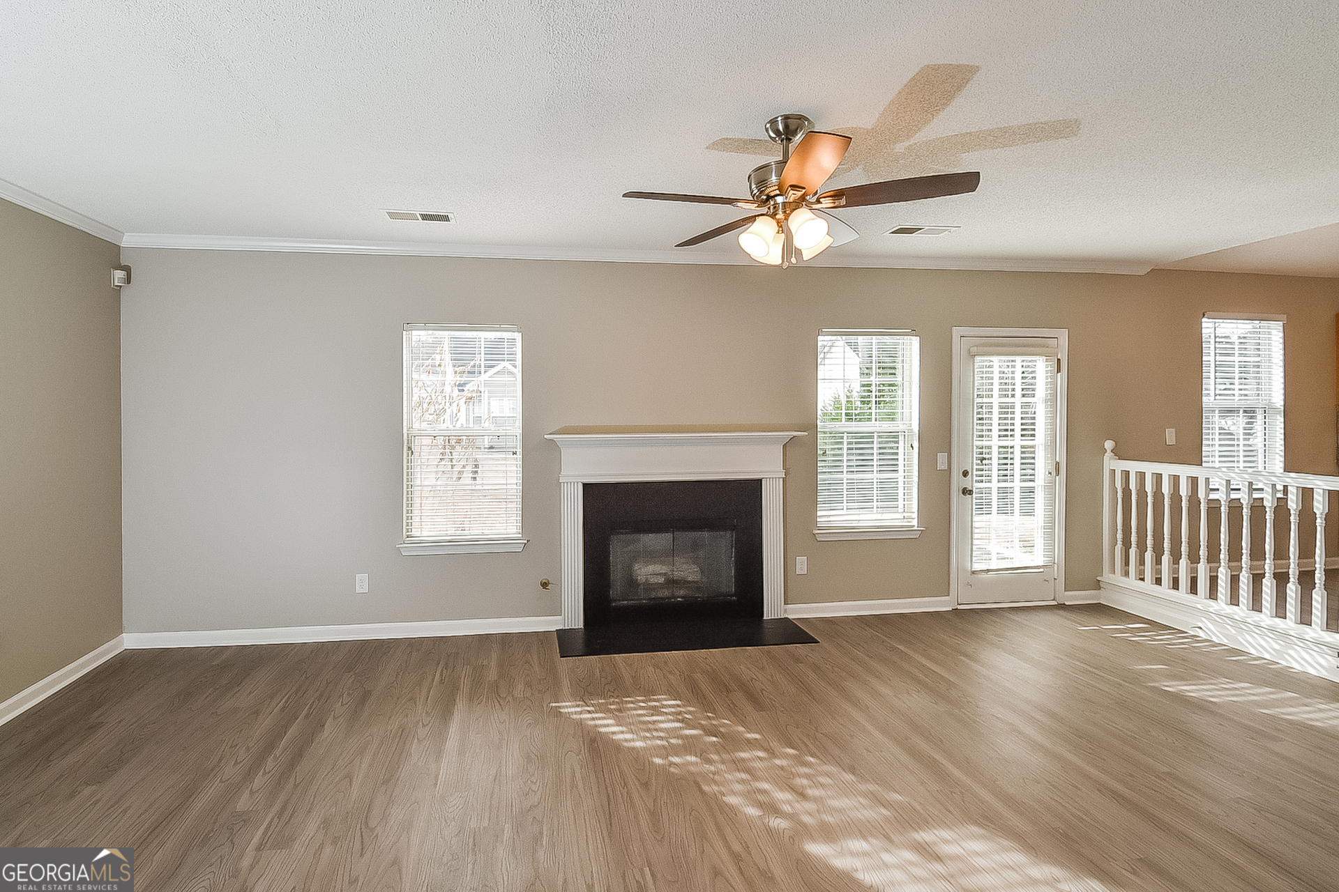 200 Teak Lane Fairburn, GA 30213 - Photo 6 of 17 a view of an empty room with a fireplace and a window