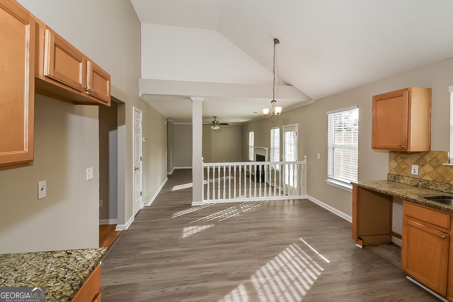 200 Teak Lane Fairburn, GA 30213 - Photo 9 of 17 a view of a hallway with wooden floor and windows
