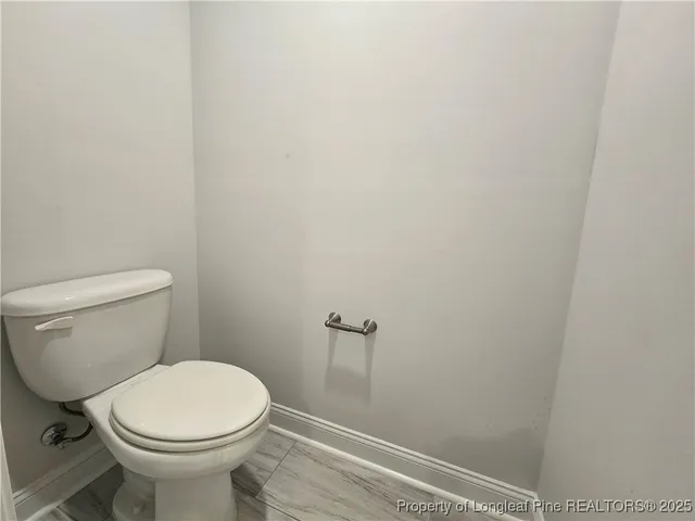 a bathroom with a toilet and a sink