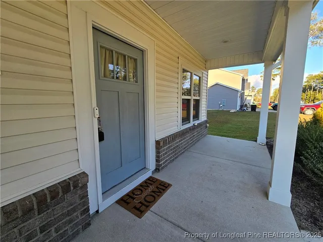 a view of a door and wooden fence