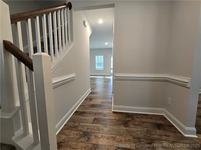 a view of entryway with stairs and wooden floor