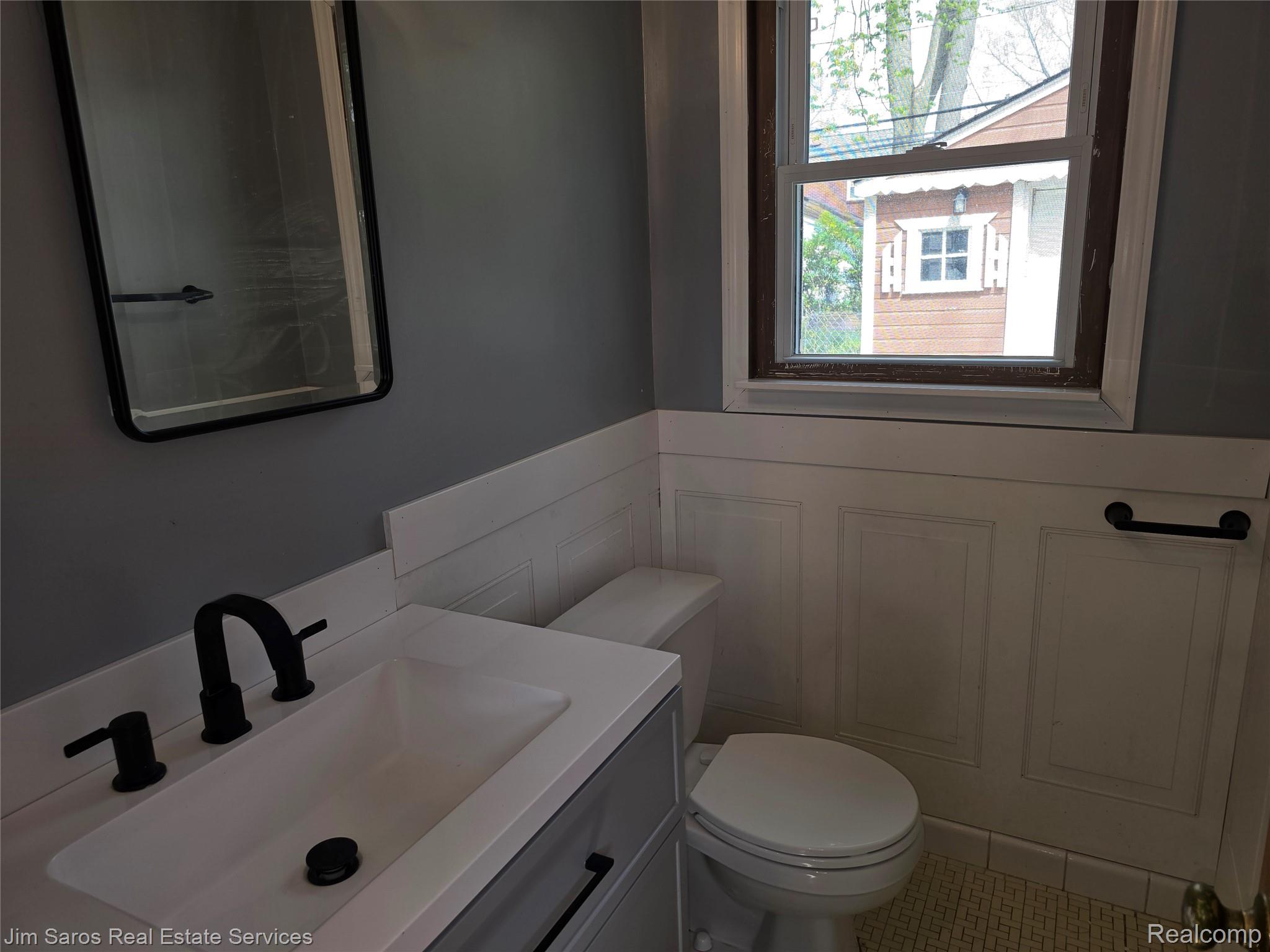 1762 Bournemouth Road Grosse Pointe, MI 48236 - Photo 10 of 21 Bathroom with vanity and a wainscoted wall