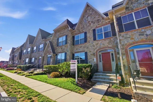 a front view of a house with yard
