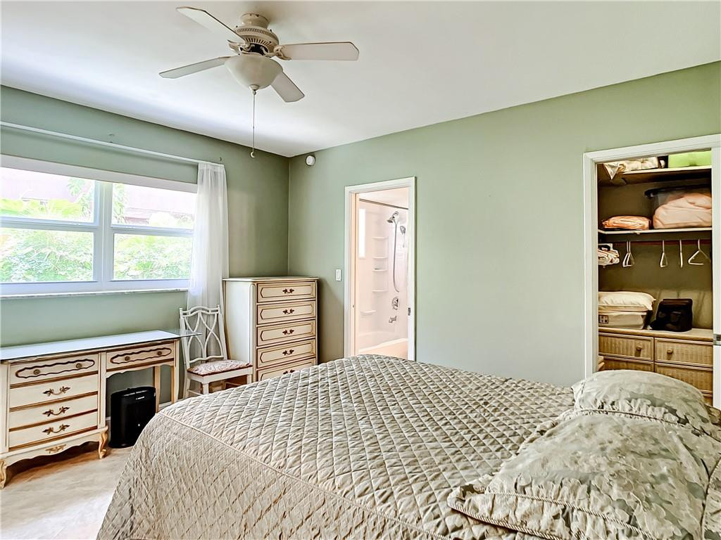 3208 Colony Club Road, Unit 2 Pompano Beach, FL 33062 - Photo 11 of 26 a bedroom with a bed and a dresser next to a window