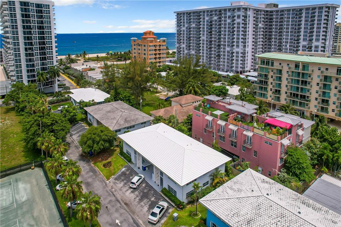 3208 Colony Club Road, Unit 2 Pompano Beach, FL 33062 - Photo 18 of 26 an aerial view of multiple houses with yard
